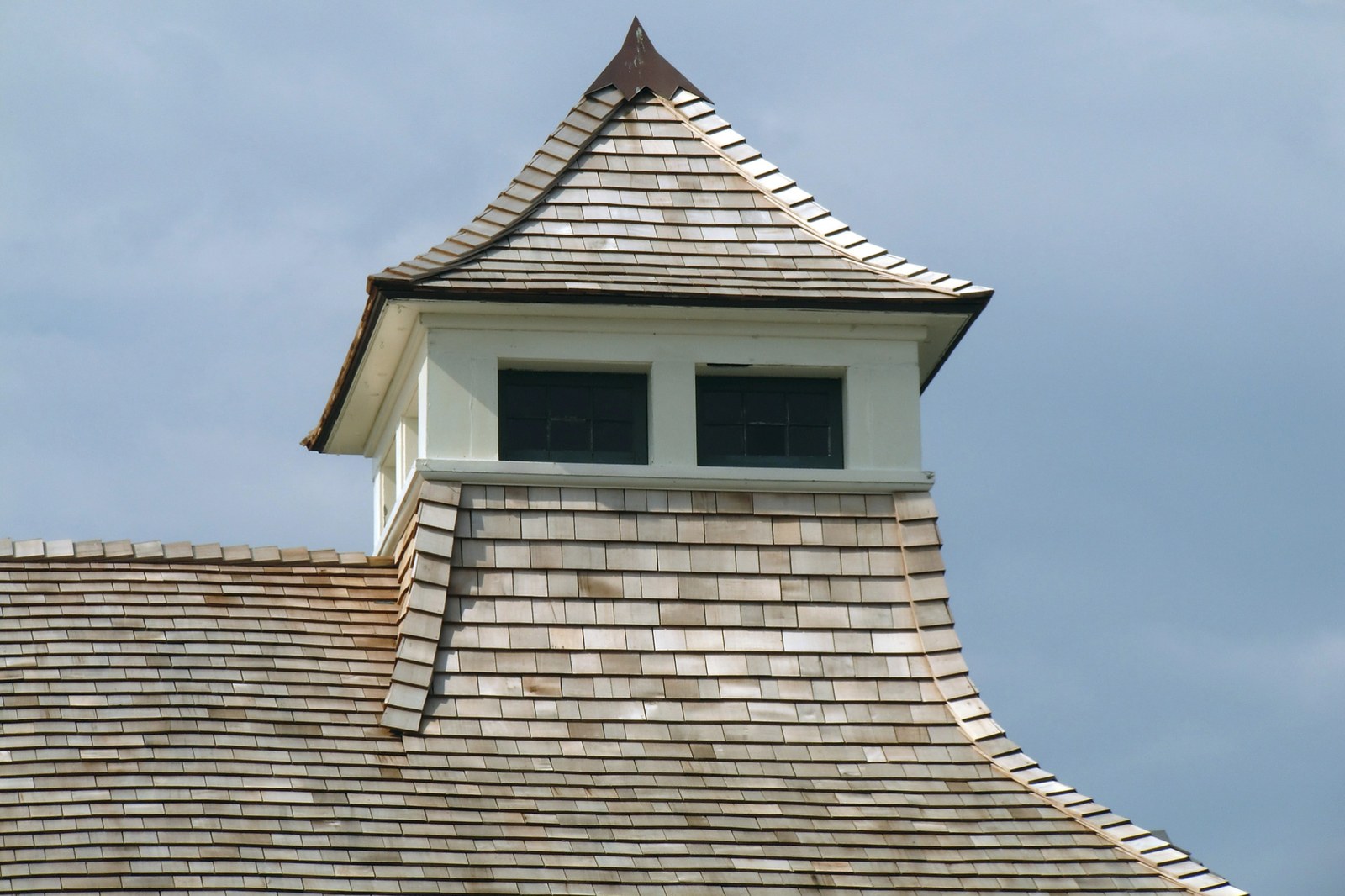 Cedar shingle sidewall wrapping a turret — photo courtesy of the Cedar Shake & Shingle Bureau