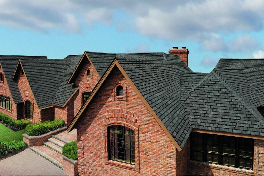 GAF Designer shingles over a brick gable — product photography courtesy of GAF