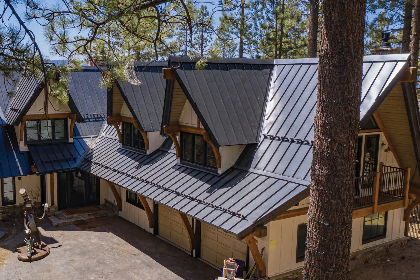 Nu-Ray standing seam on a lodge in the pines — product photography courtesy of Nu-Ray Metals
