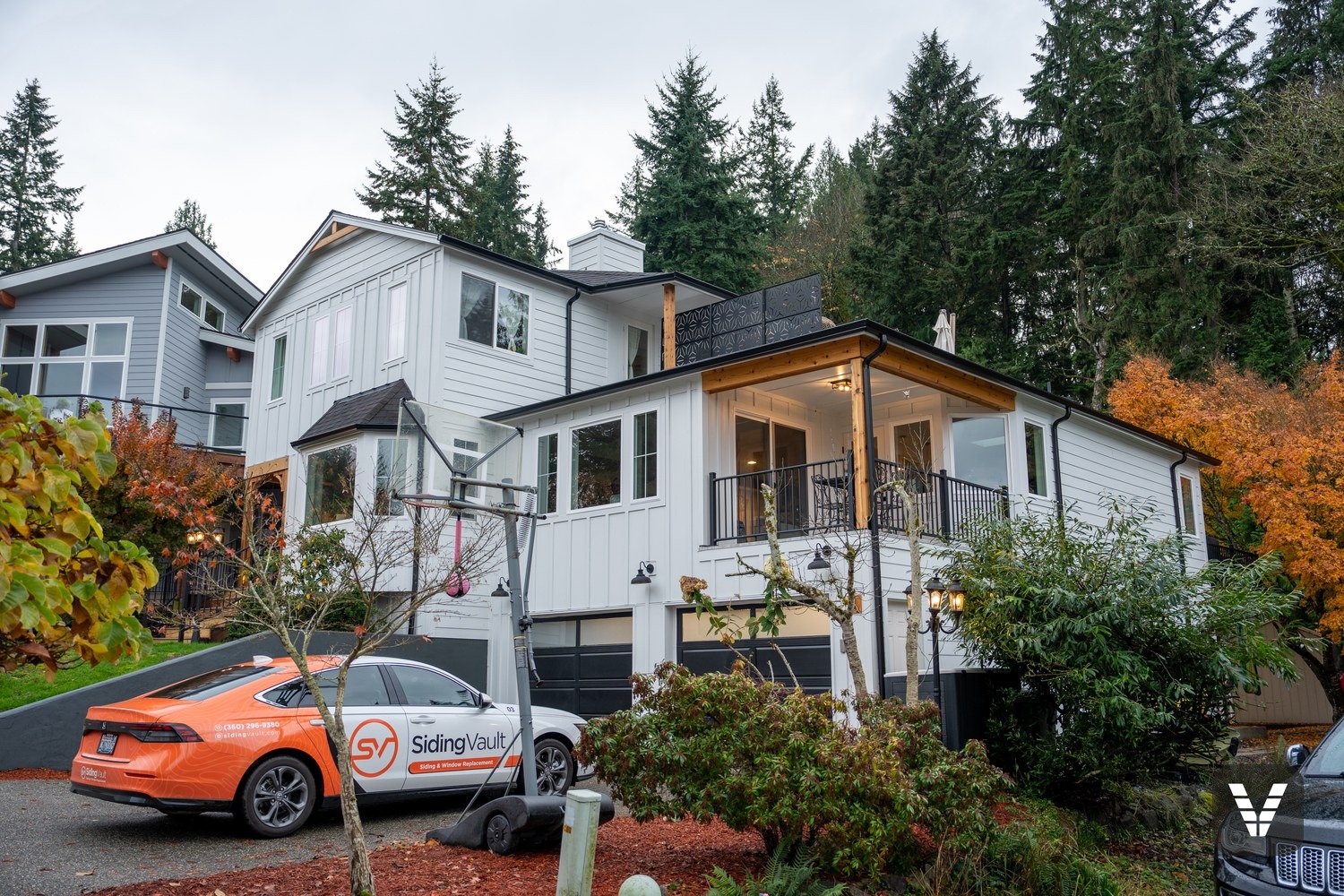 After — Arctic White James Hardie board-and-batten remodel by Siding Vault