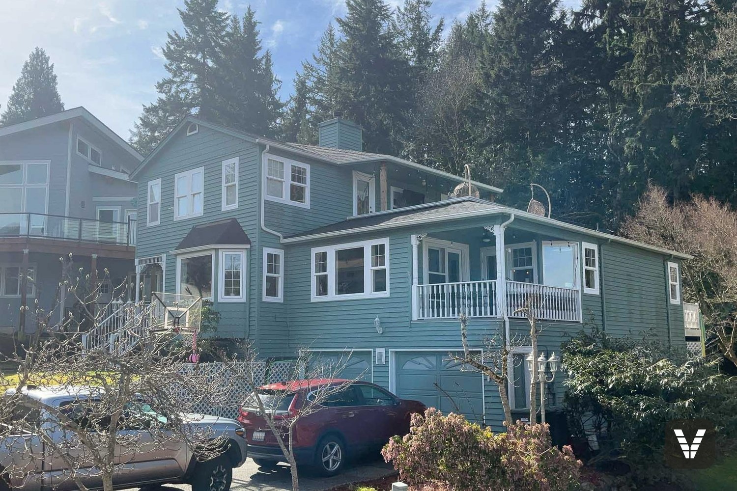 Before — original teal lap siding on a Bellingham home