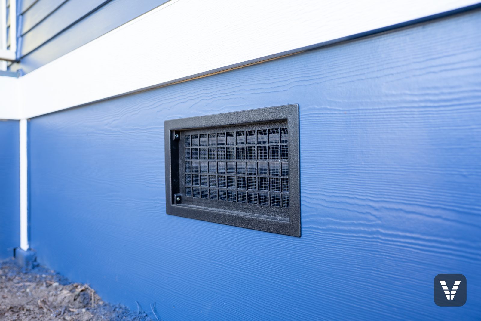 New crawlspace vent set into the Hardie panel skirting