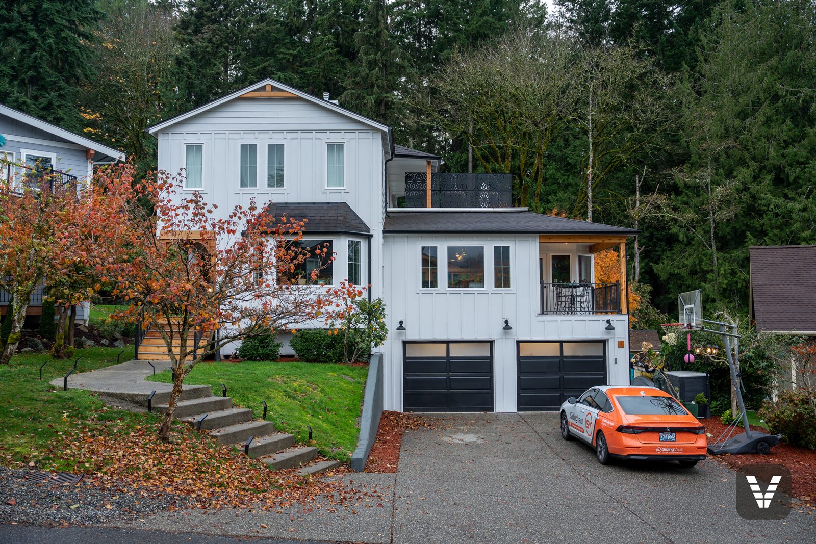 Street view of the finished Hardie remodel in autumn