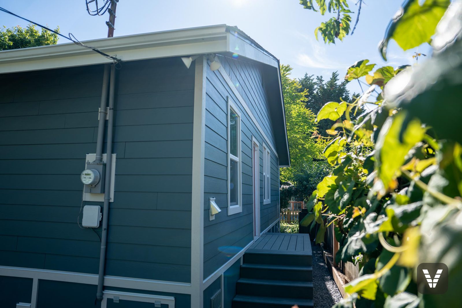 Side elevation — utilities remounted over fresh Evening Blue lap