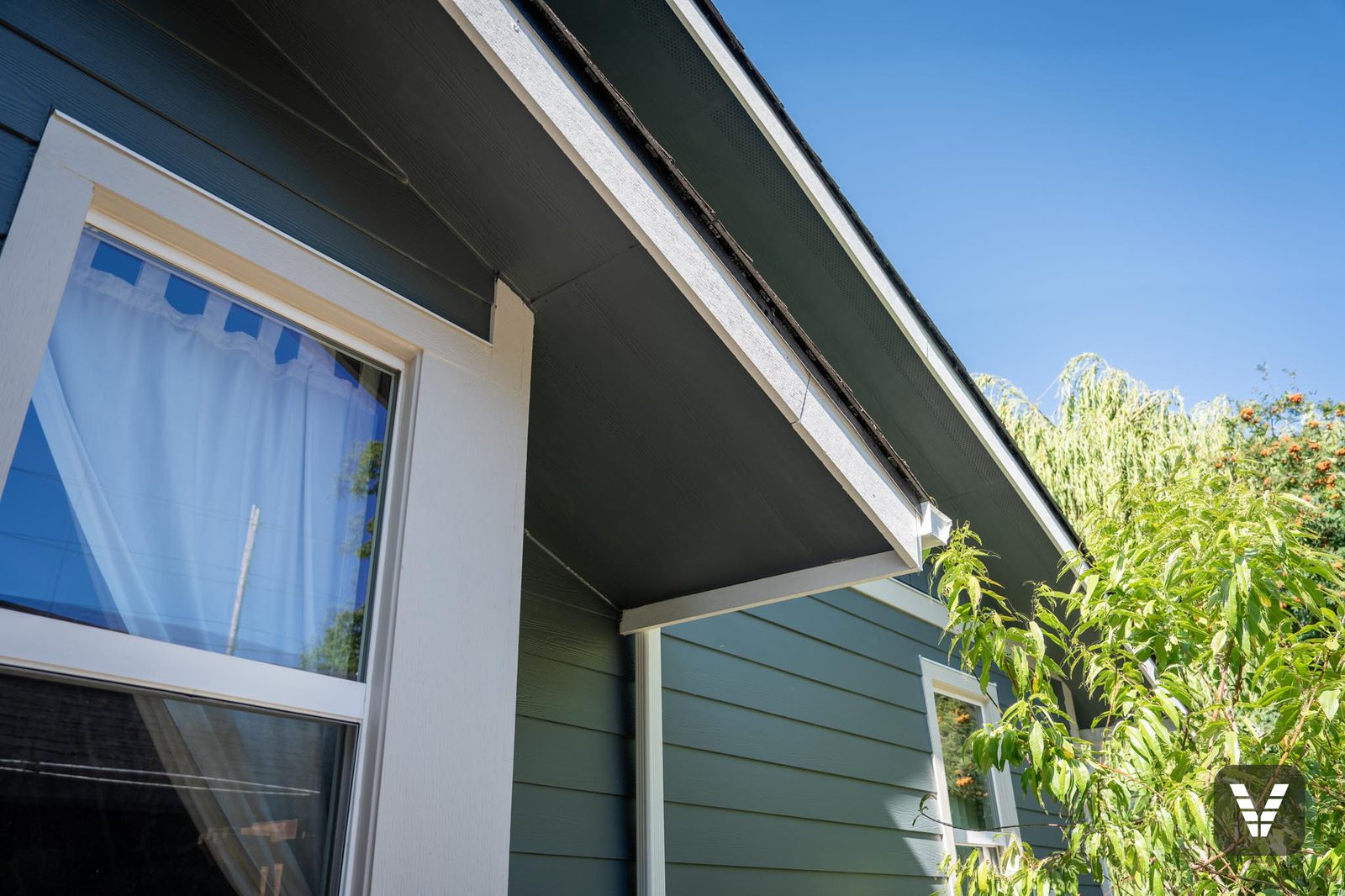 New vented HardieSoffit over the window, painted to match — Siding & Window Vault project in Bellingham, WA