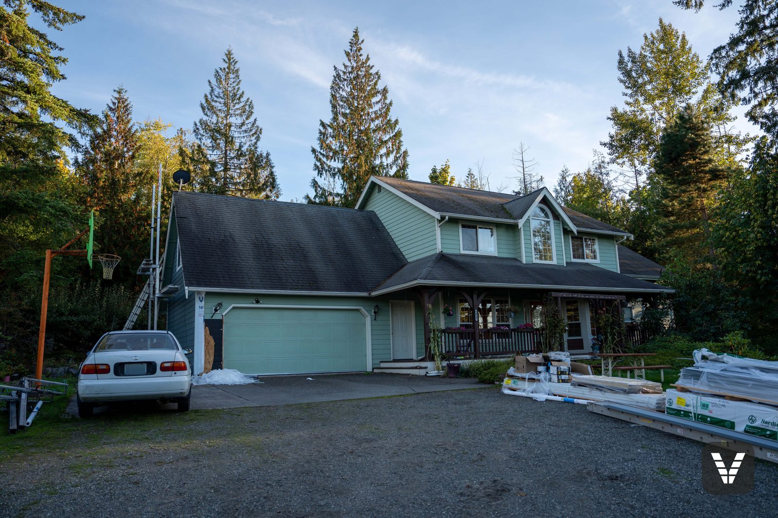 The "all-green photo" — aging green LP panel siding before tear-off — before, Bellingham, WA