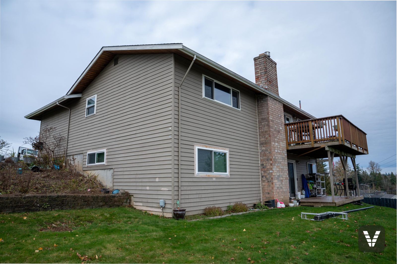 Before — the chimney side in the old tan lap siding — before, Ferndale, WA