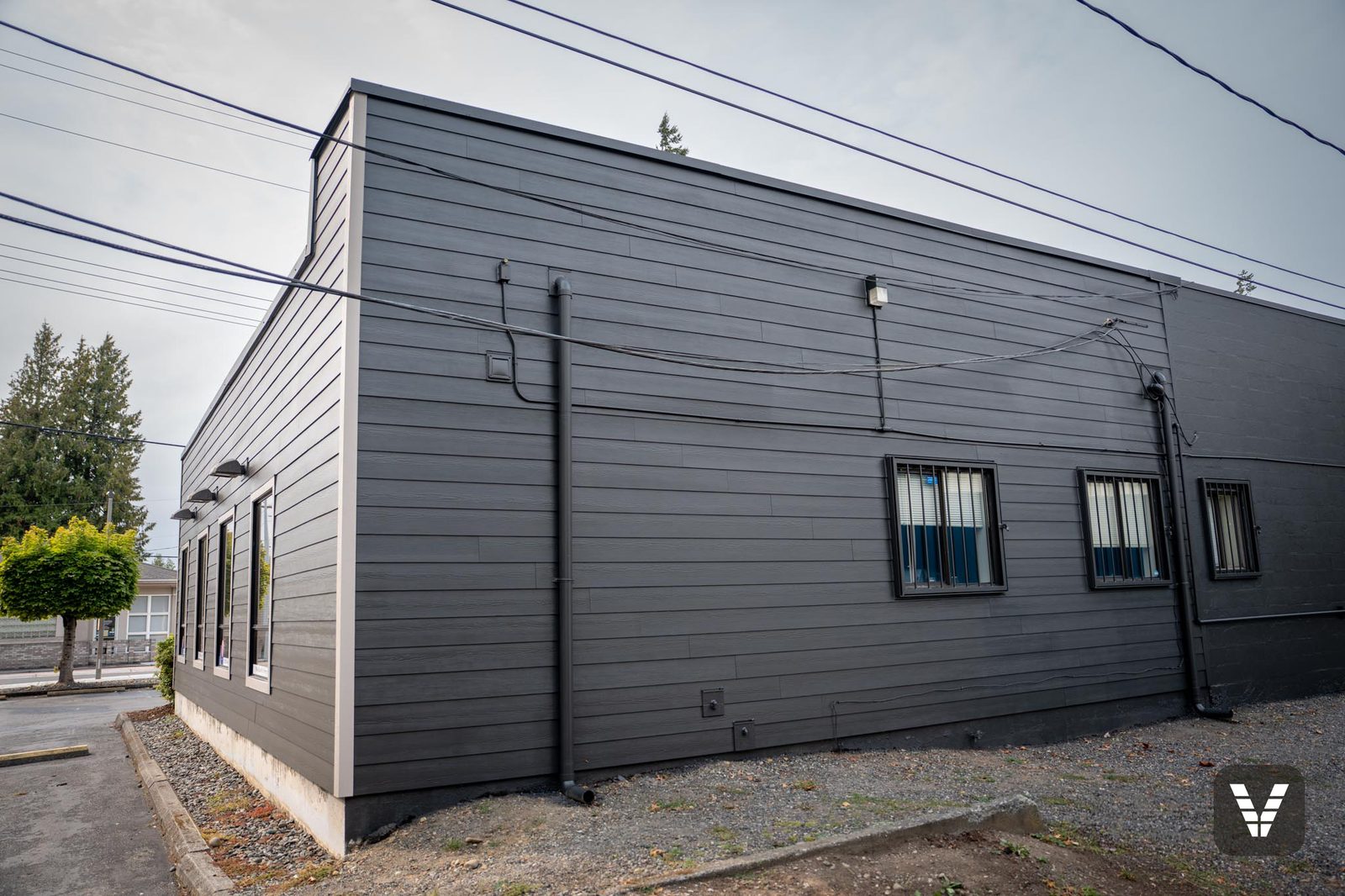 Long rear elevation re-sided in James Hardie fiber cement