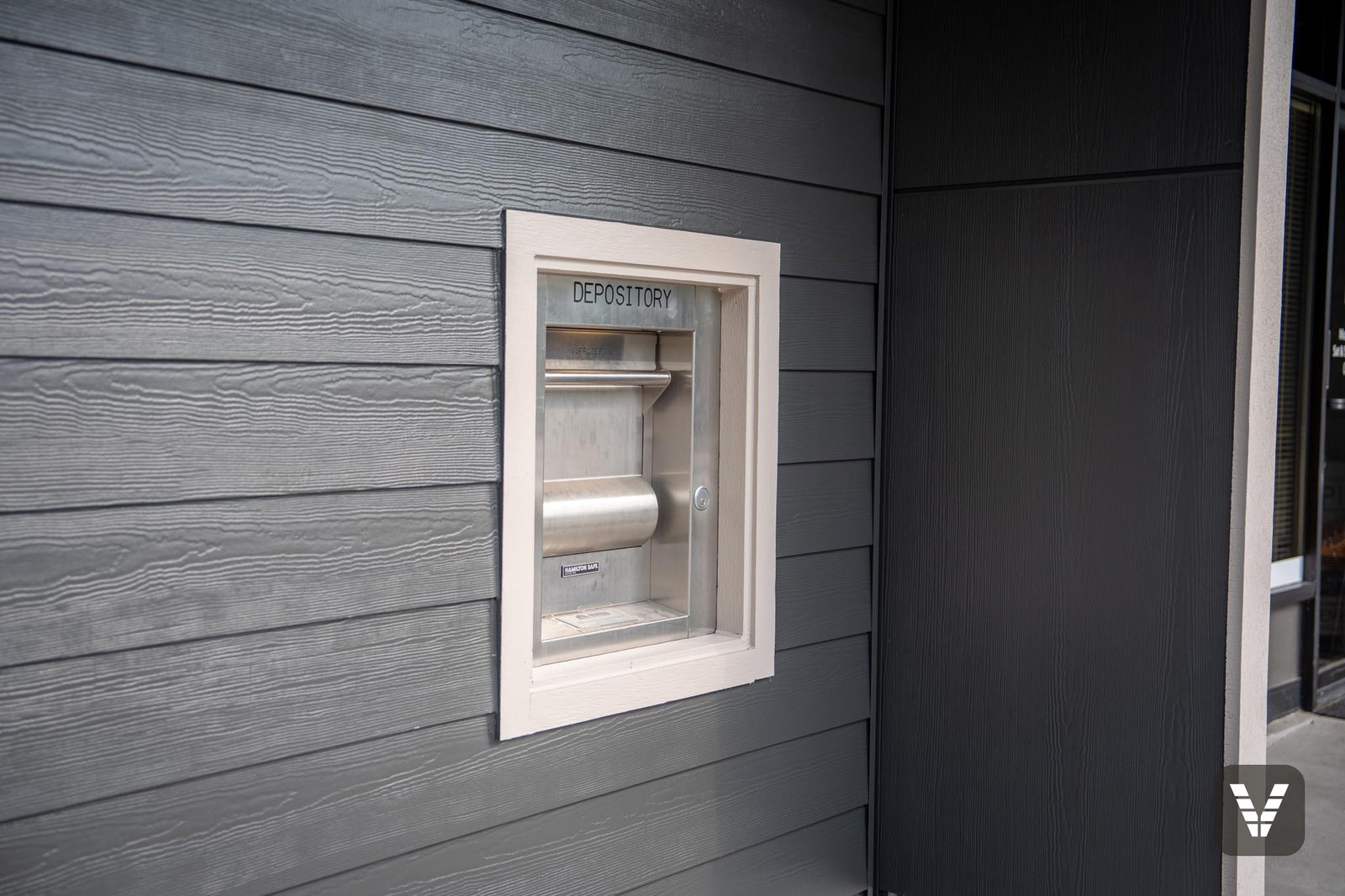 Trim detail — the tenant depository box wrapped in HardieTrim and flashed