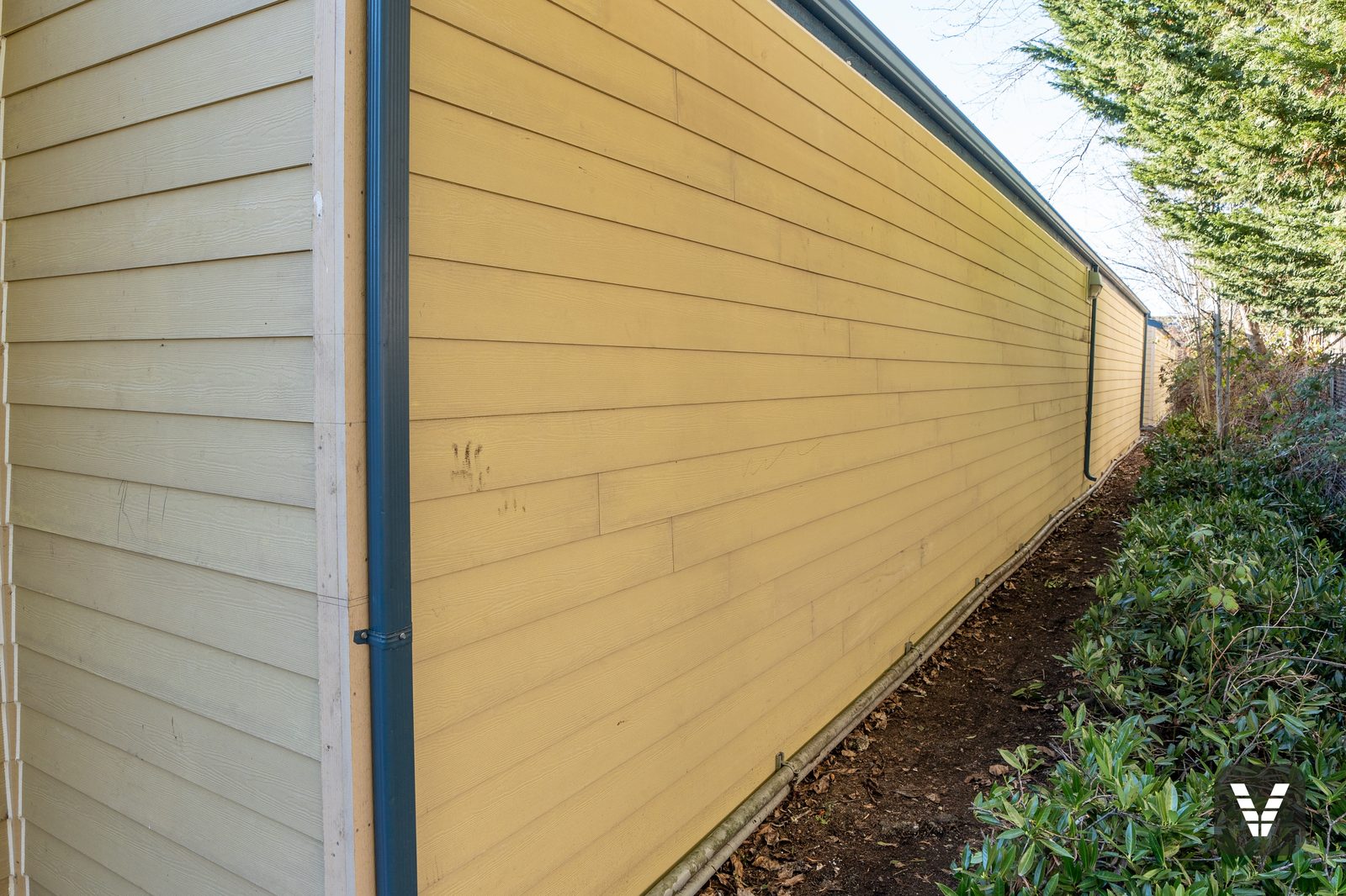The narrow rear run — full-length walls re-sided where nobody but the crew will ever stand