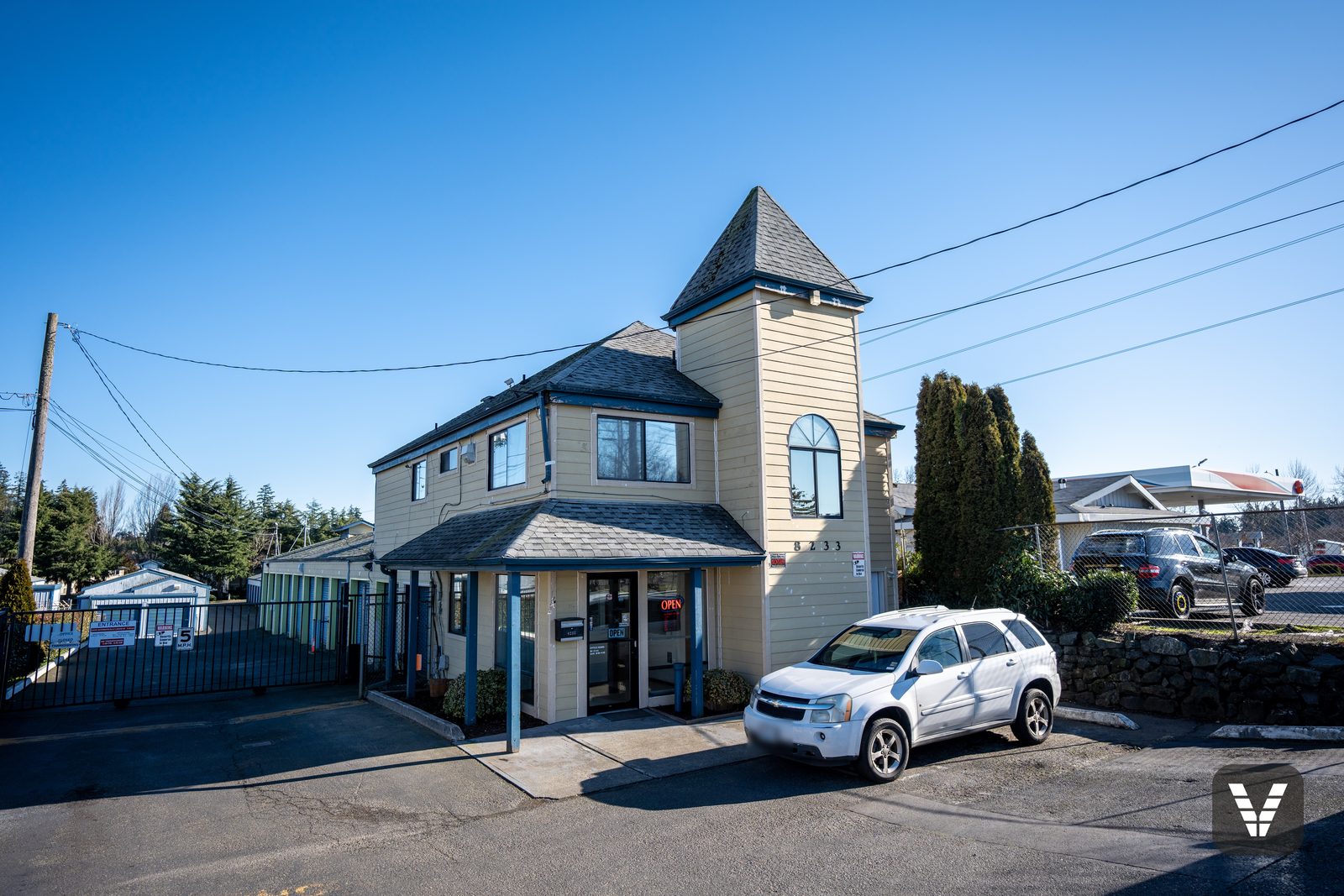 Self-storage office building with turret in fresh primed James Hardie lap siding, Tacoma WA