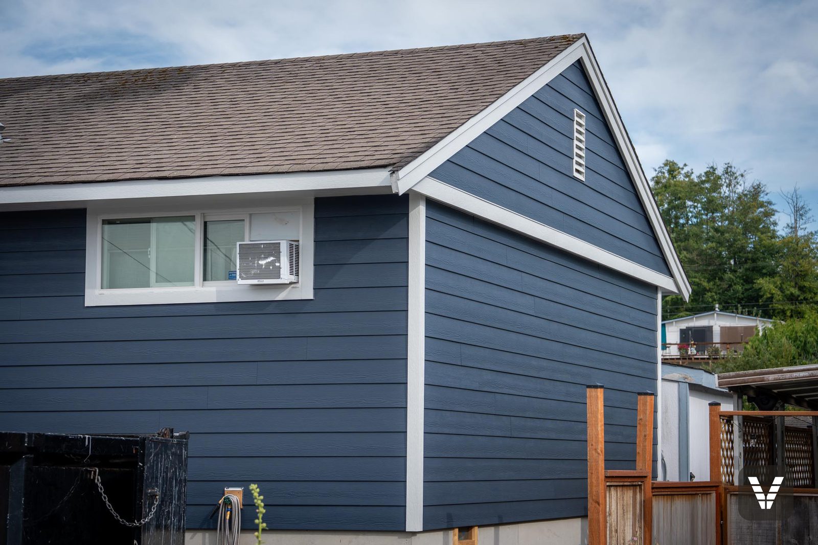 Gable end in Deep Ocean HardiePlank with Arctic White trim lines