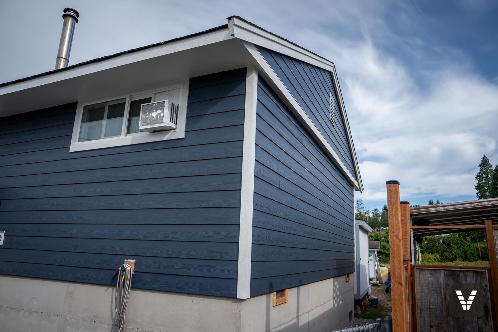 Corner and chimney against fresh Deep Ocean Cedarmill lap