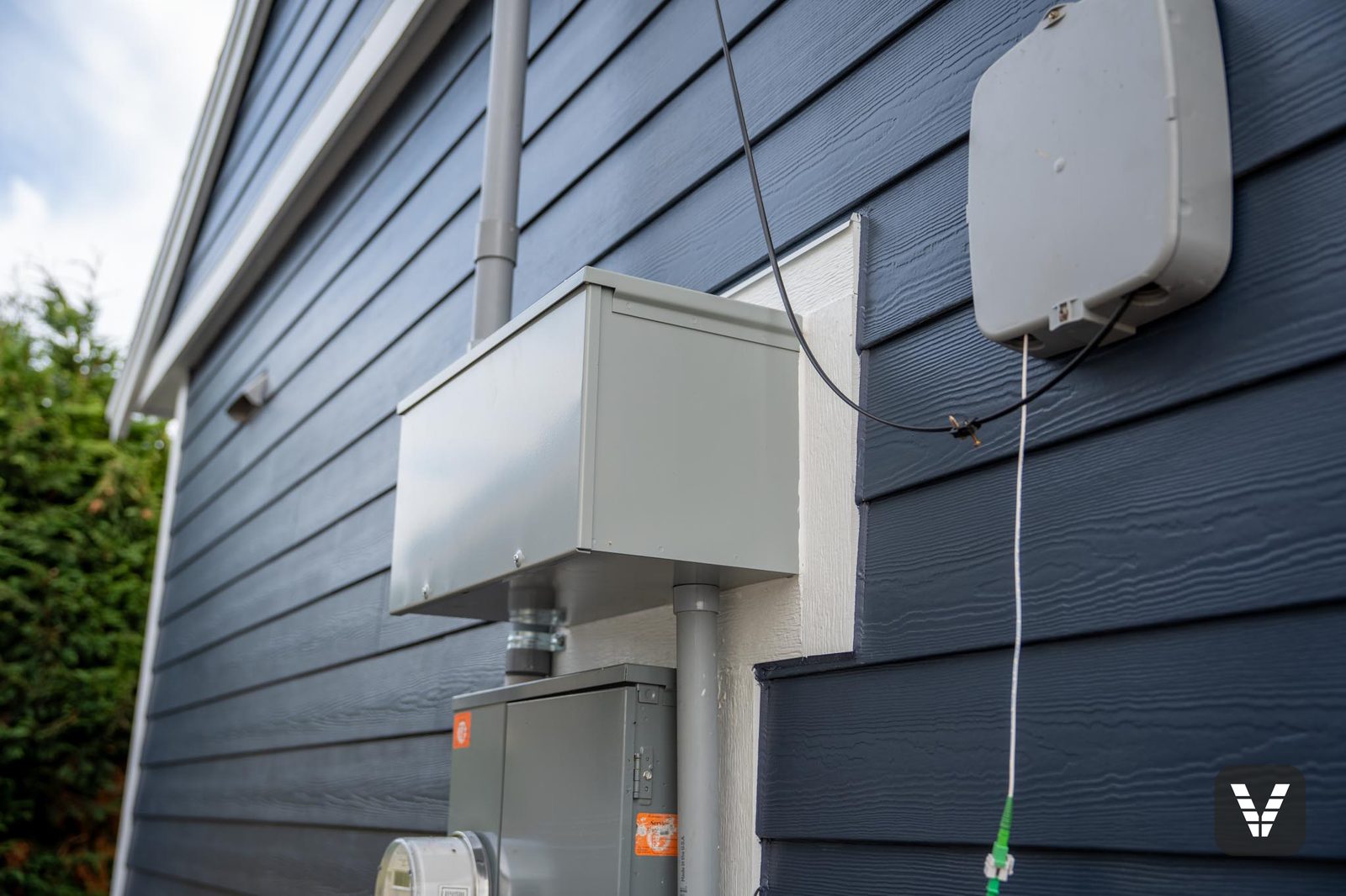 Utilities remounted on Hardie blocks over the finished siding