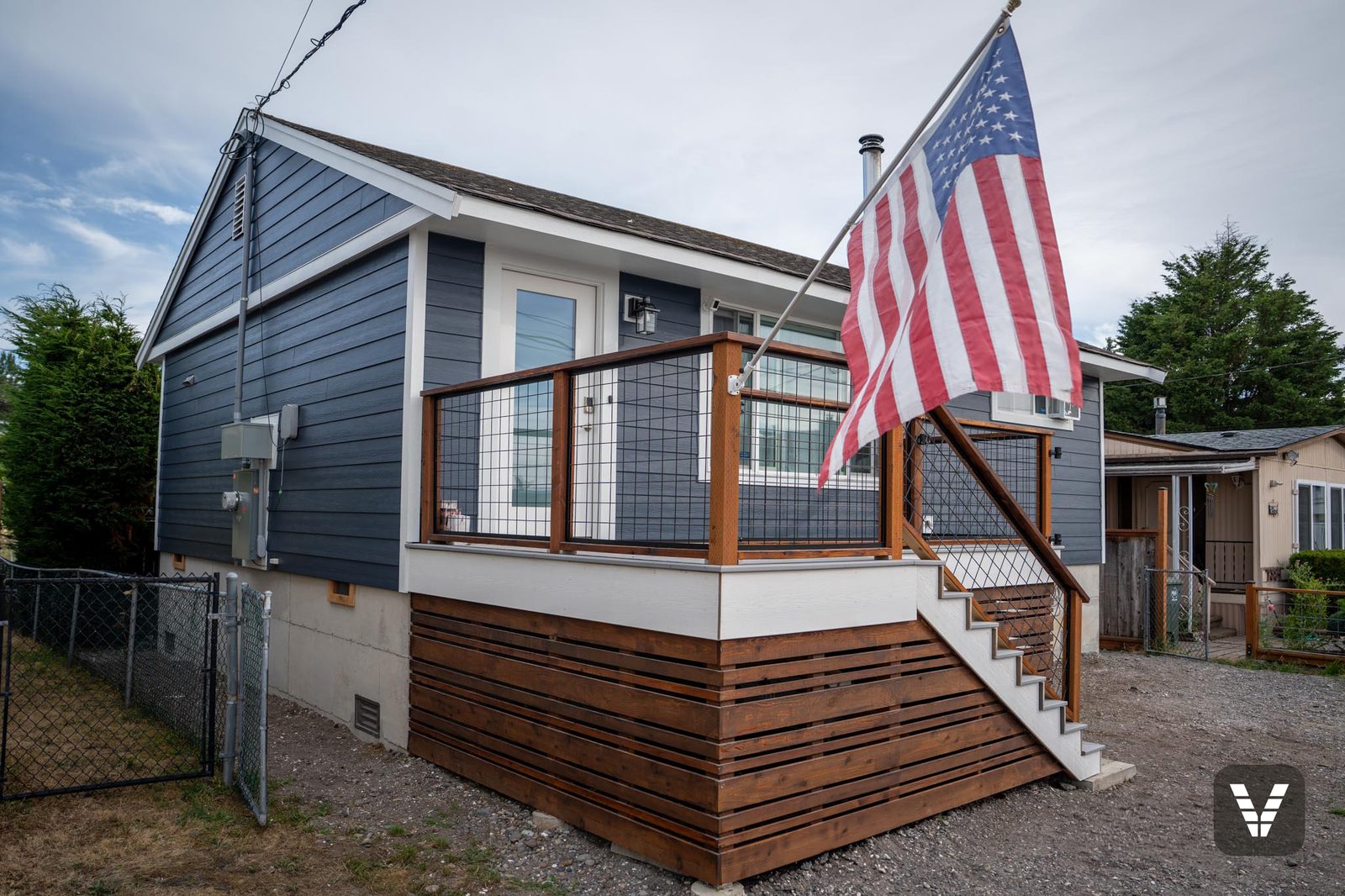 Completed Deep Ocean James Hardie re-side with Arctic White trim on a Birch Bay beach cottage