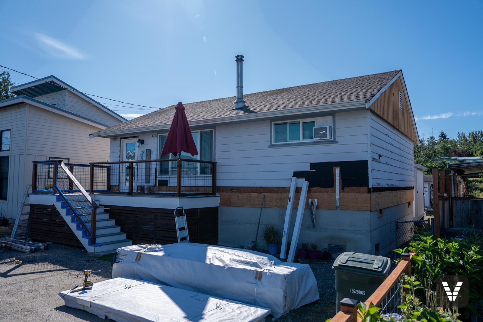 Before — deck and main elevation with Hardie bundles staged — before, Birch Bay, WA