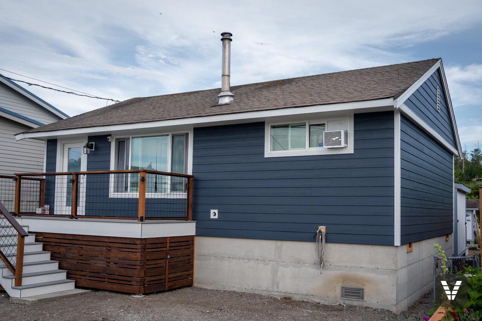 Completed Deep Ocean James Hardie re-side with Arctic White trim on a Birch Bay beach cottage — after, SWV project in Birch Bay, WA