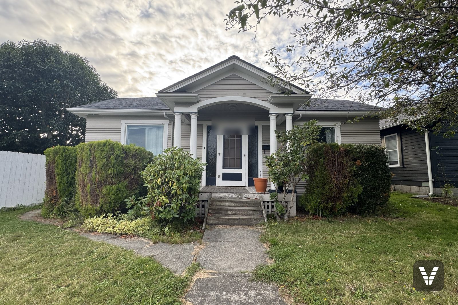 Before — entry and portico in tired cream lap siding — before, Bellingham, WA