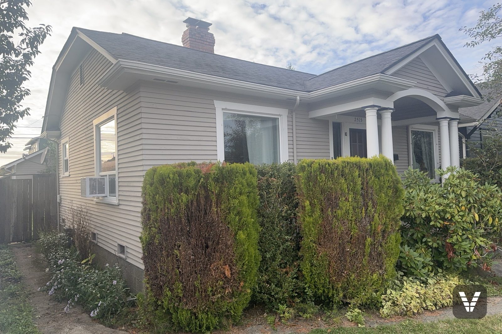 Before — front-left corner in original cream lap siding — before, Bellingham, WA