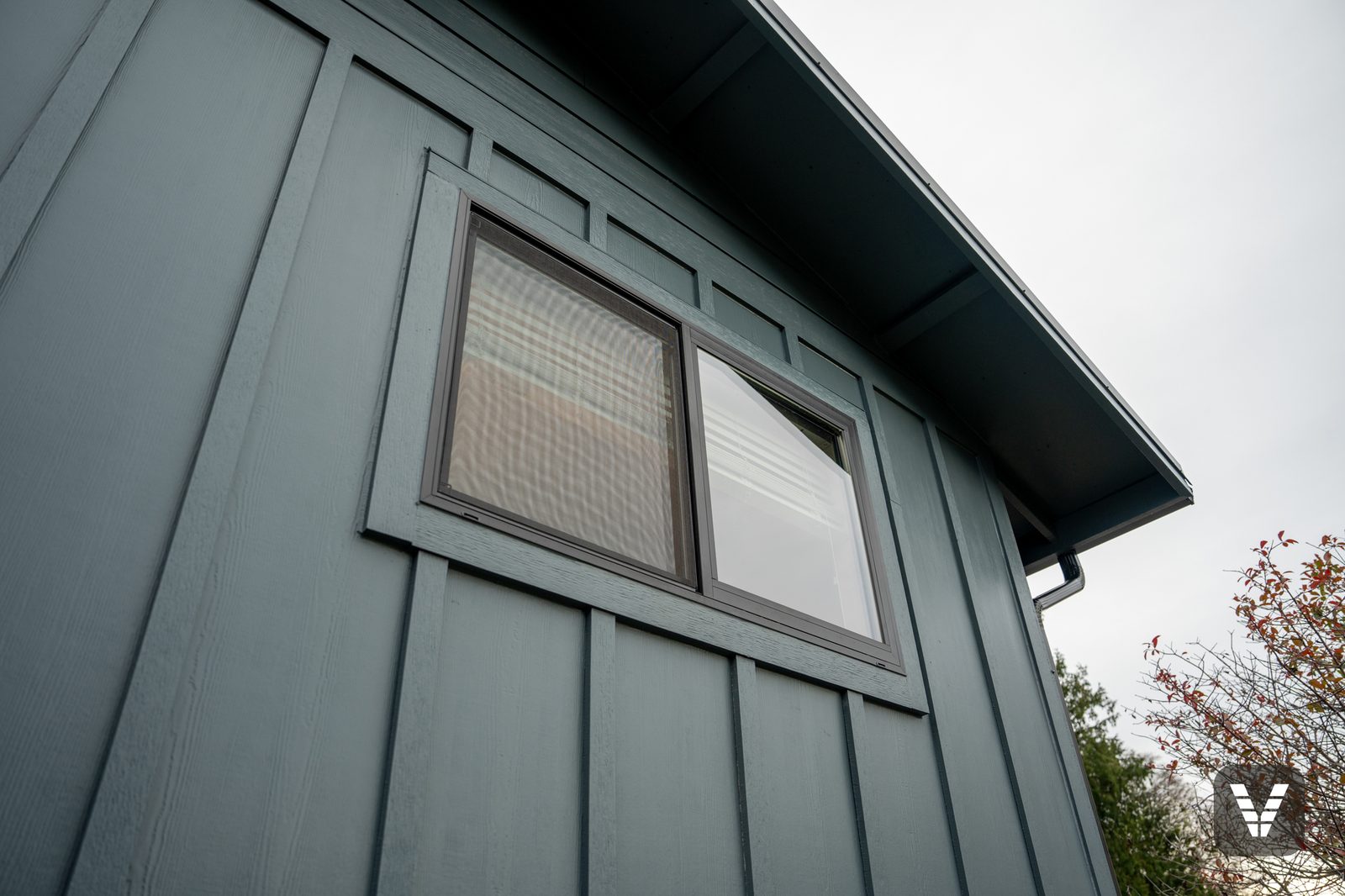 A new dark-framed slider set and sealed, wrapped in Evening Blue HardieTrim, Anacortes, WA