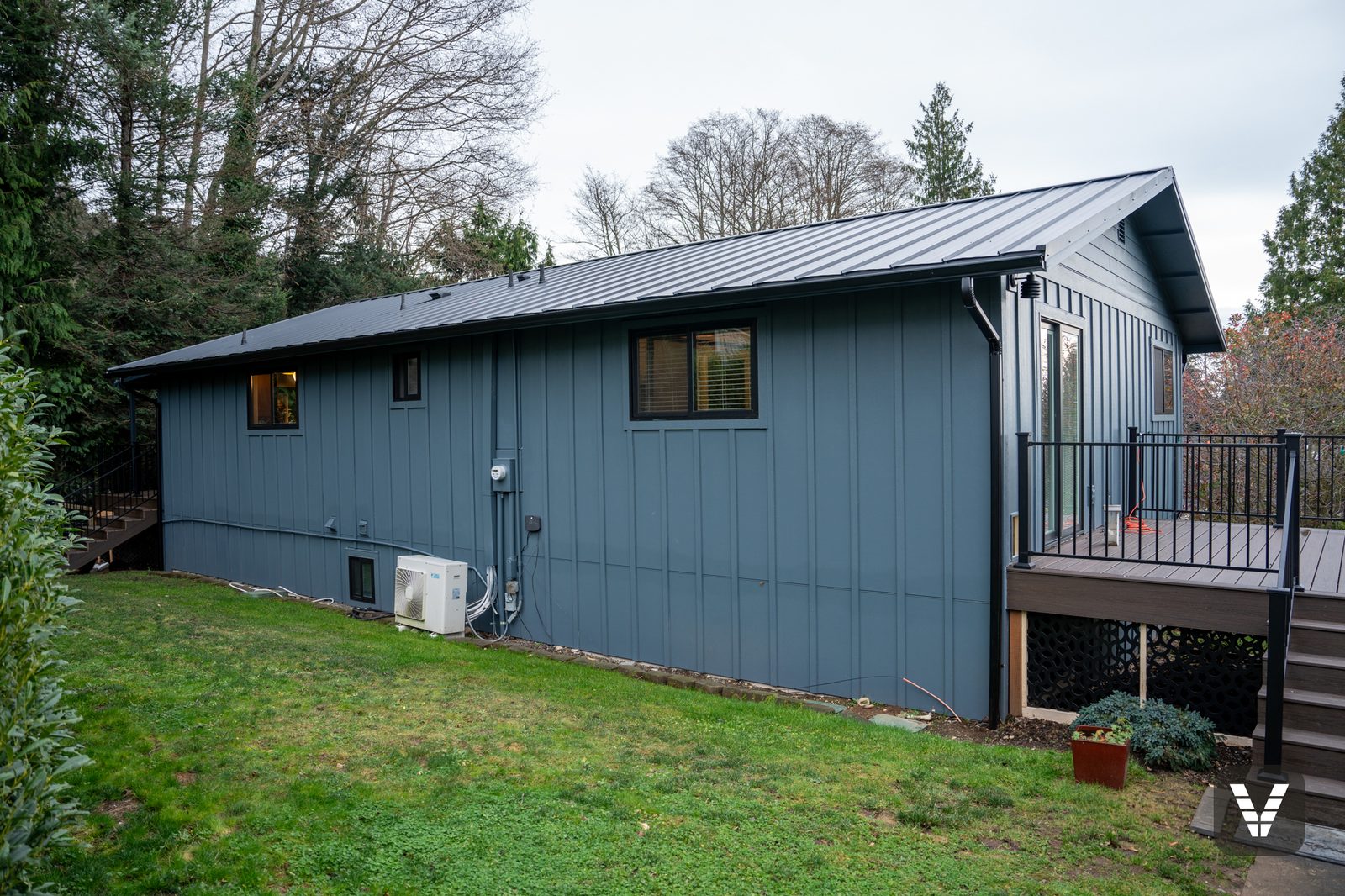 Long side elevation showing vertical HardiePanel and battens under the metal roof