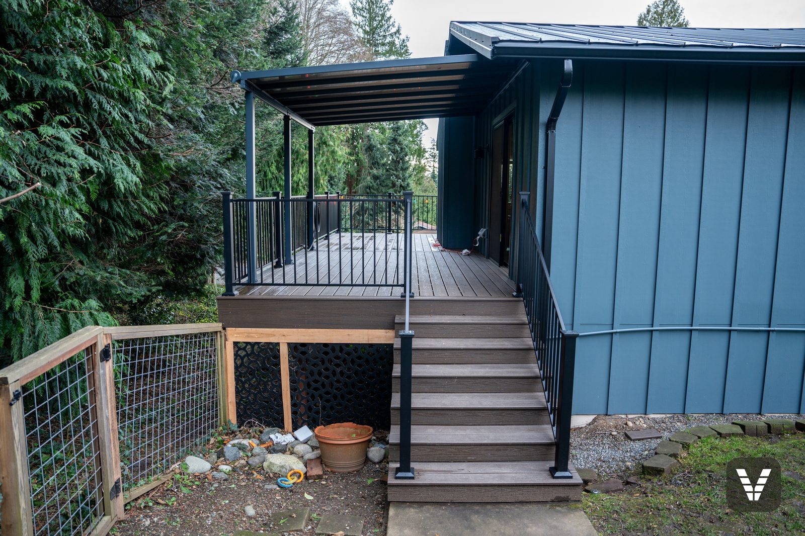 Covered deck and new Trex stairs at the entry — Siding & Window Vault project in Anacortes, WA