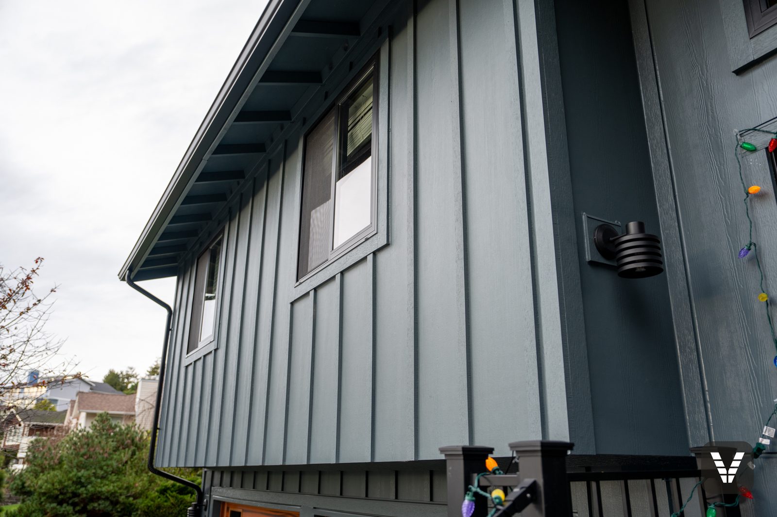 Board-and-batten texture detail with new exterior light fixture