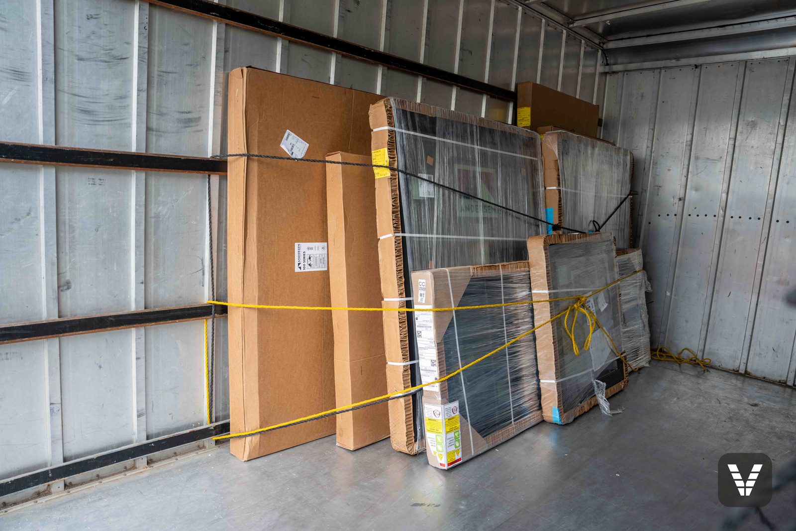 The new windows arriving — units strapped and staged in the delivery trailer, Anacortes, WA