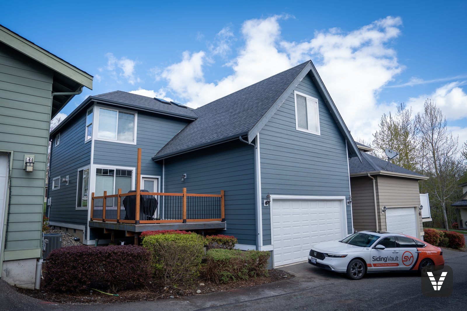 The finished view — rear garage — hardie delivery staged in the before — after, SWV project in Ferndale, WA