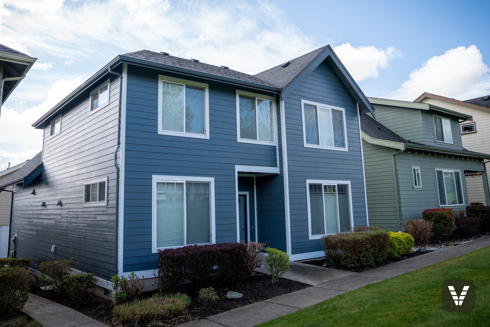 Front approach — Evening Blue HardiePlank lap with Arctic White HardieTrim surrounds — after, SWV project in Ferndale, WA