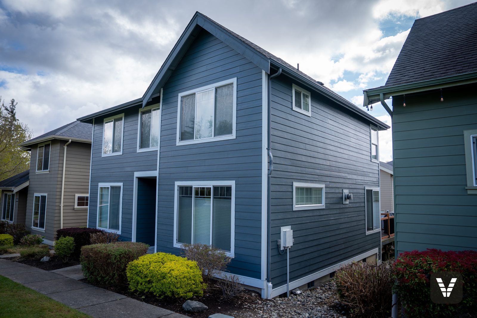 Side elevation — the full-plank layout replacing the old mixed siding — after, SWV project in Ferndale, WA