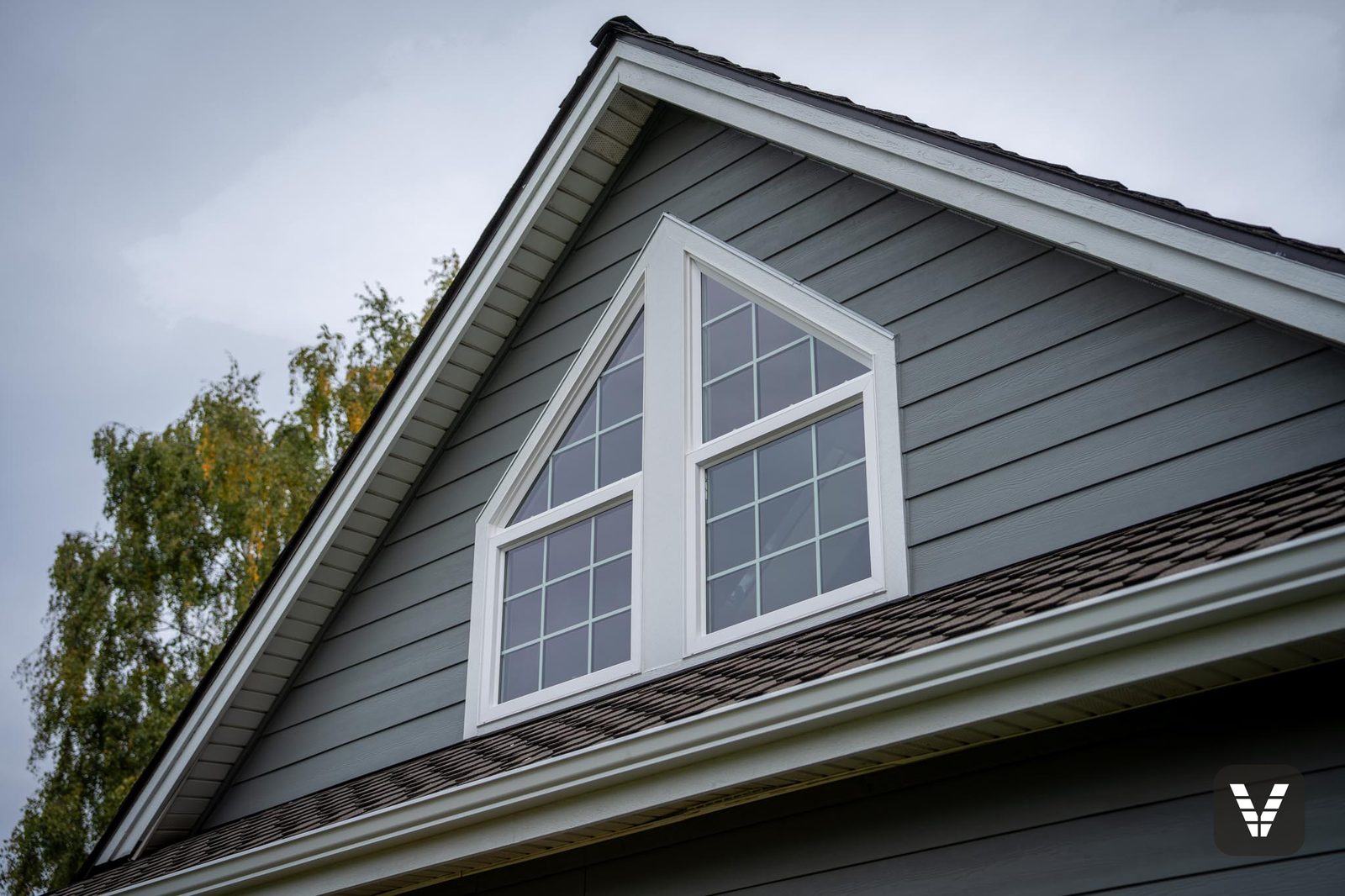 Custom Ply Gem combination window — fixed picture pane over an awning unit — in an Anacortes gable