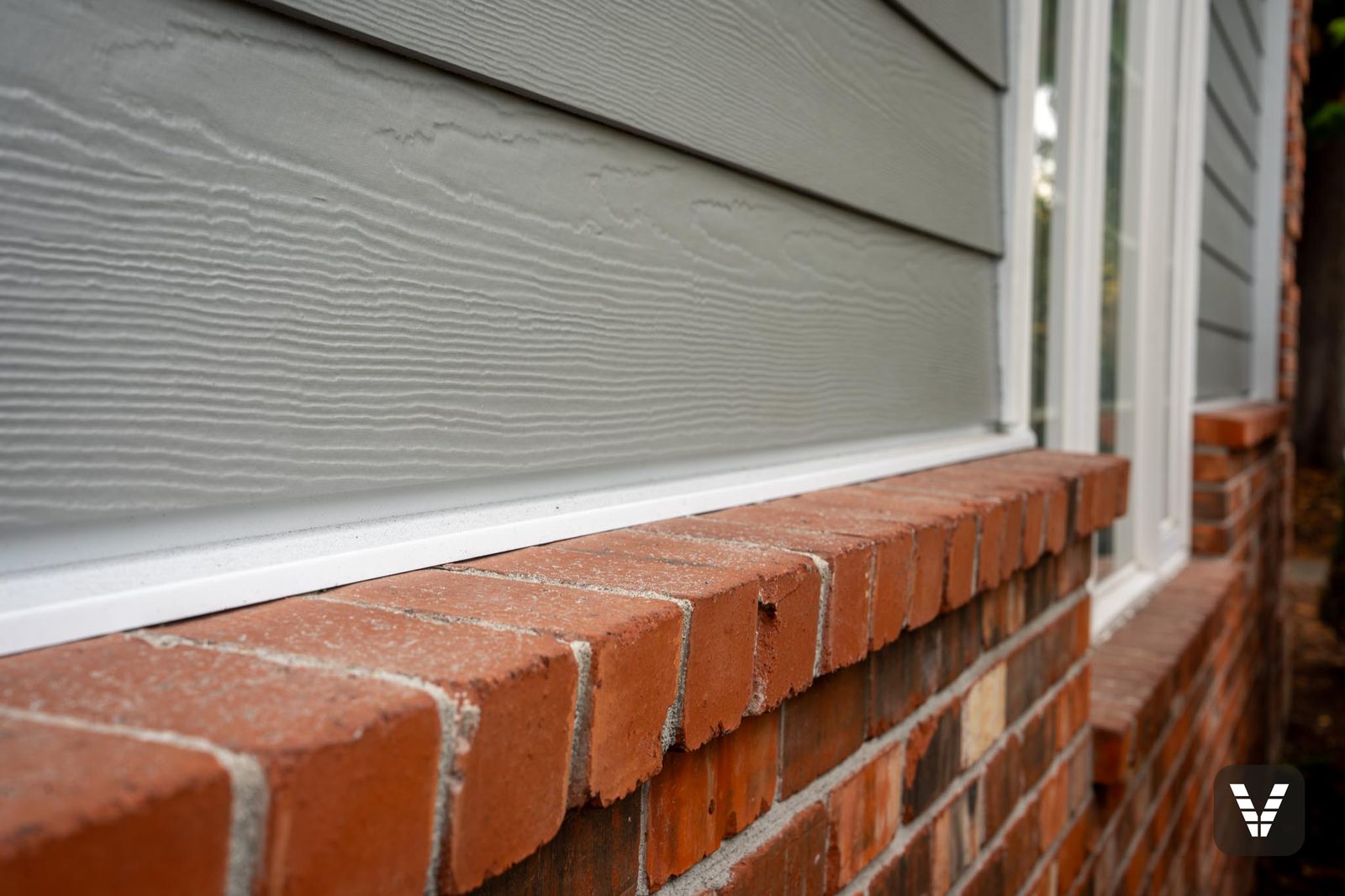 James Hardie Cedarmill fiber cement texture up close — the material we install instead of vinyl
