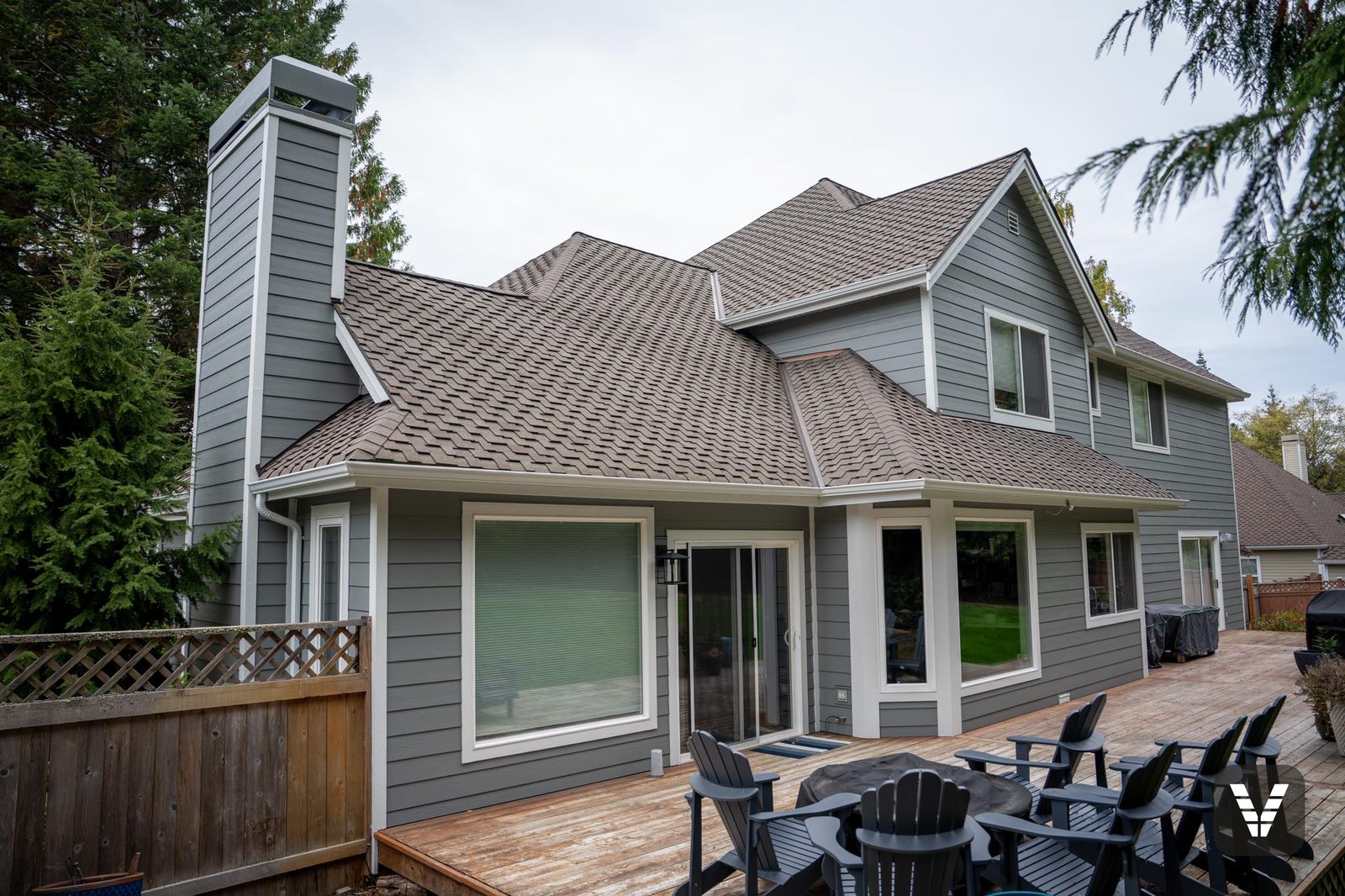 The back deck and re-clad chimney after the re-side