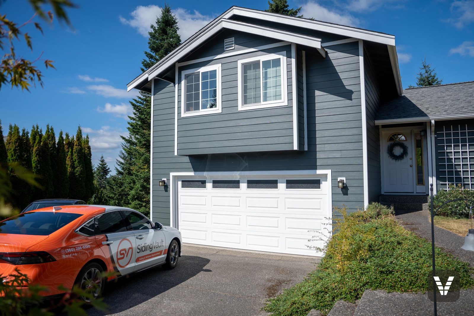 The finished front from the driveway, Siding Vault car below the new windows