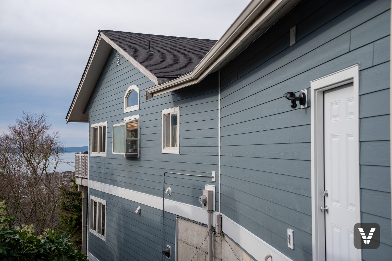 The side gable with its arched window — trim heat-formed in one continuous curve
