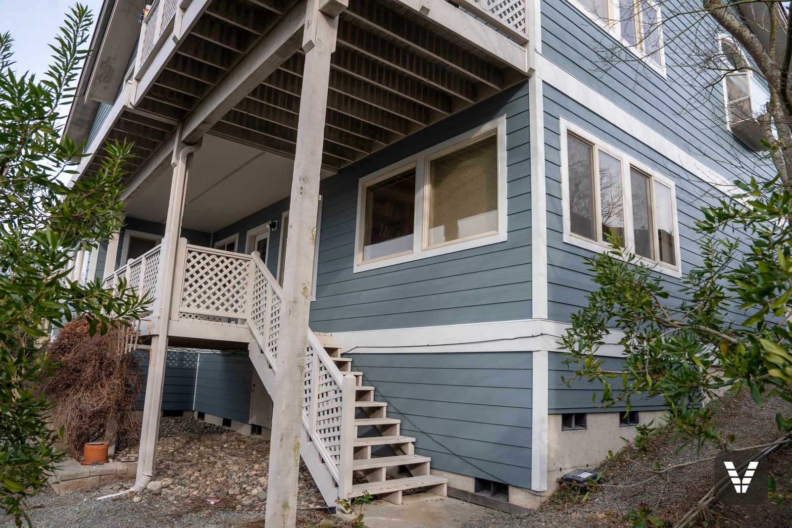 Under the deck — new lap and lattice at the lower level — Siding & Window Vault project in Anacortes, WA