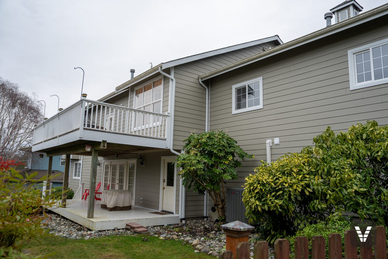 Lower porch (original surface) under the re-decked upper deck, French doors and new lap