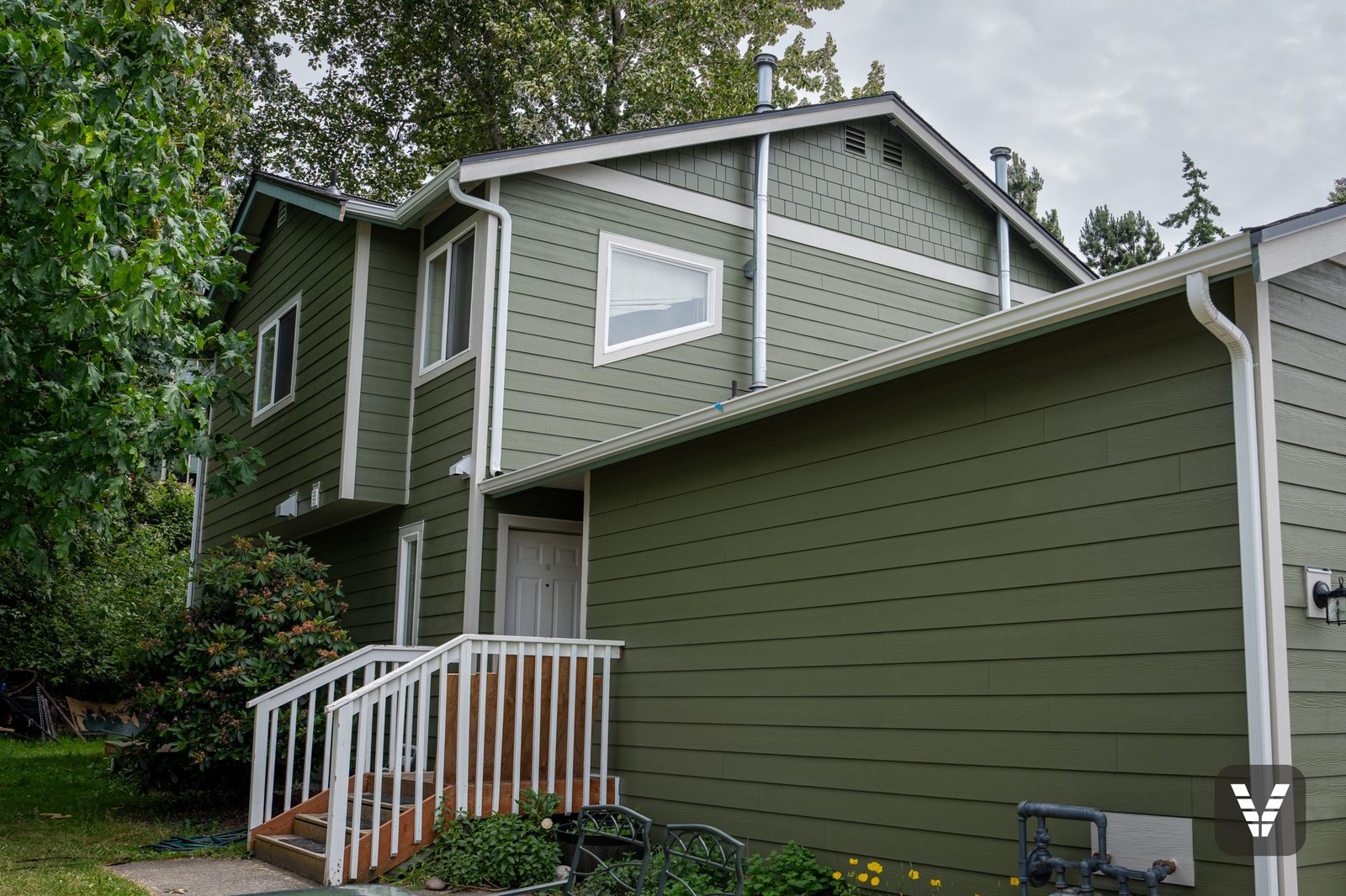 The second unit's entry and rebuilt stair rail