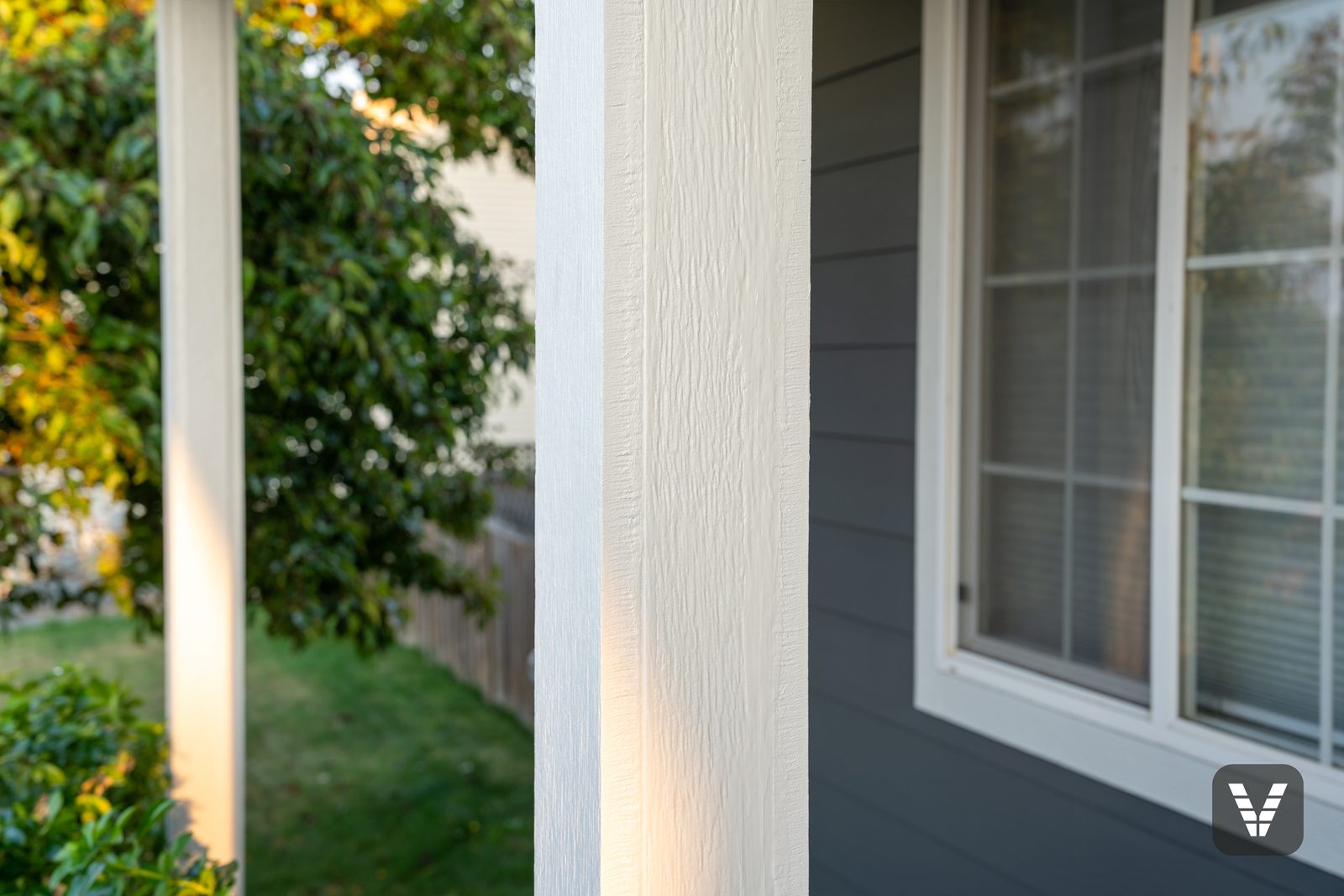 Porch column and Cedarmill lap up close in the evening light