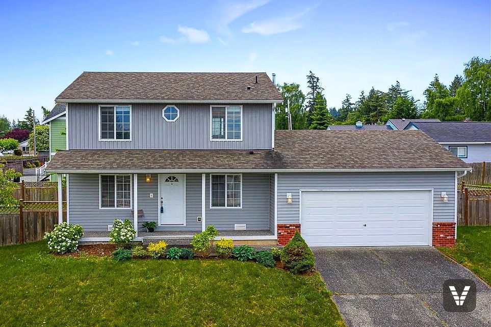 Front elevation before the re-side — original worn vinyl siding — before, Anacortes, WA