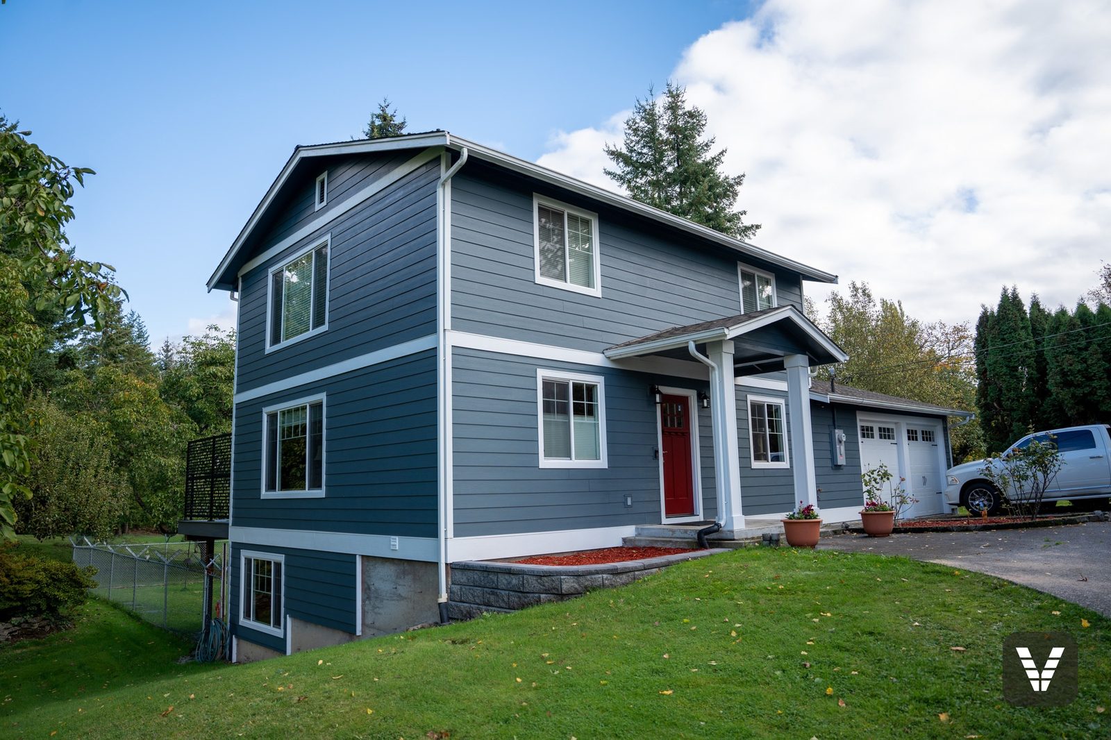 Evening Blue HardiePlank from the Statement Collection with Arctic White trim on a Ferndale two-story
