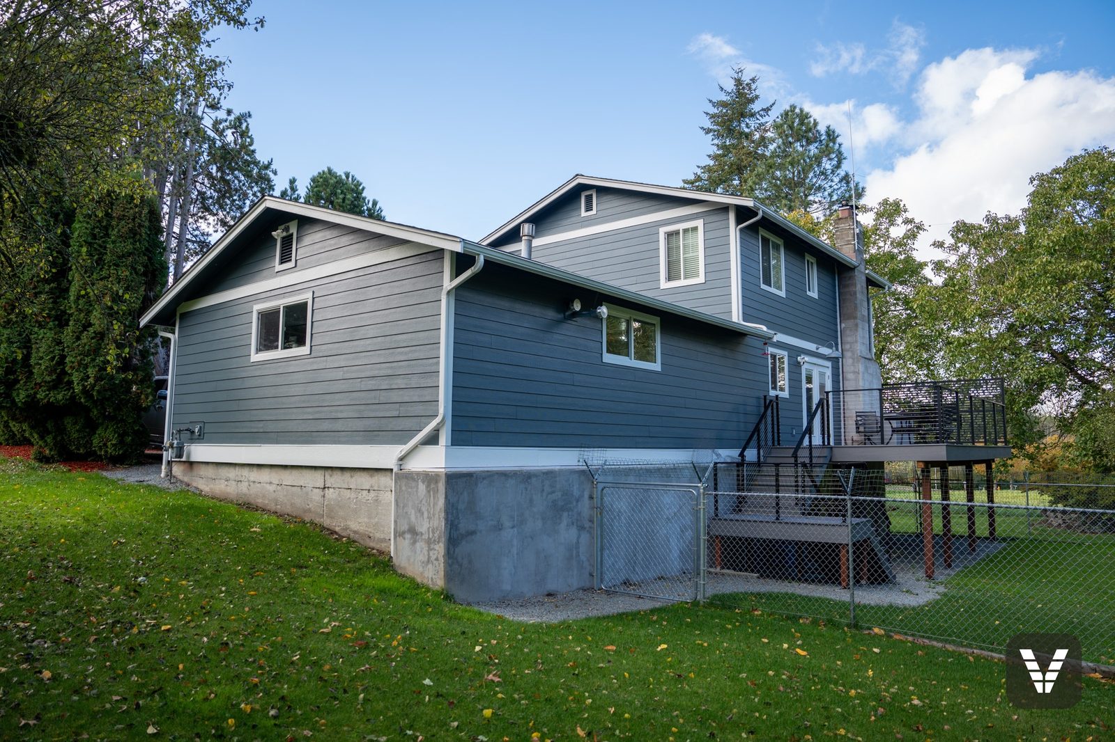 The rear of the home in fresh lap, the old second-floor deck gone — after, SWV project in Ferndale, WA