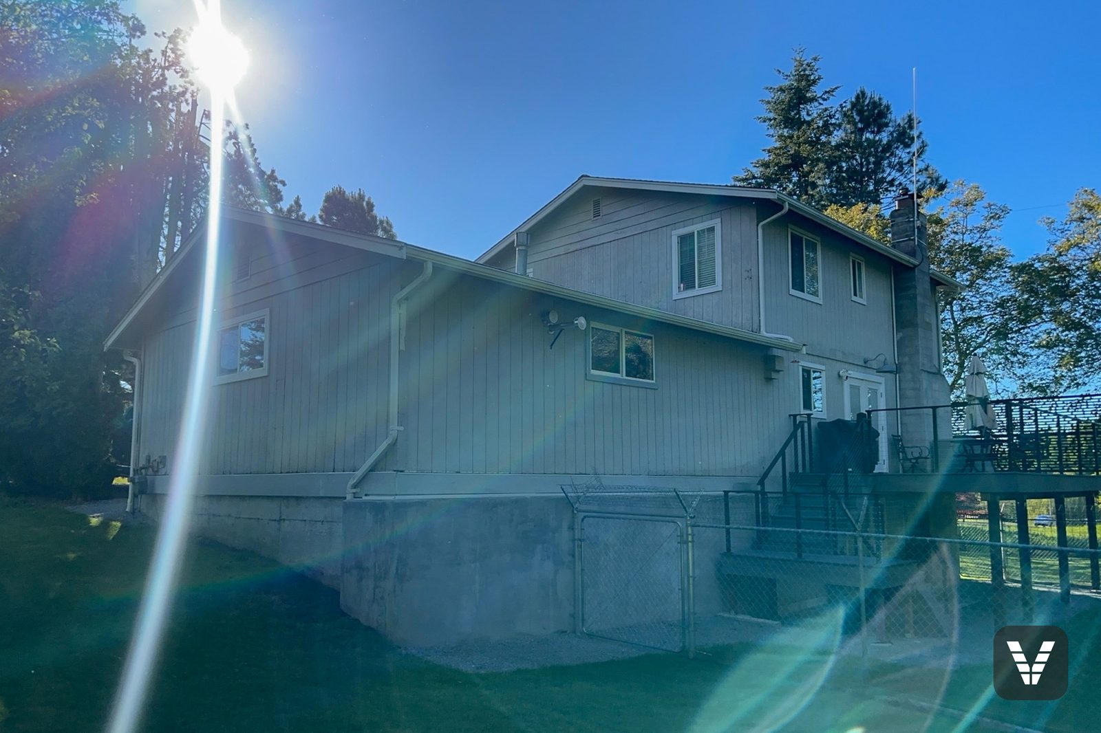Rear of the home before, with the aging second-floor deck still in place — before, Ferndale, WA