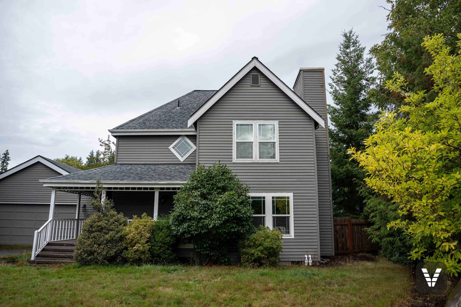 The chimney side before the re-side, in worn gray lap siding — before, Bellingham, WA