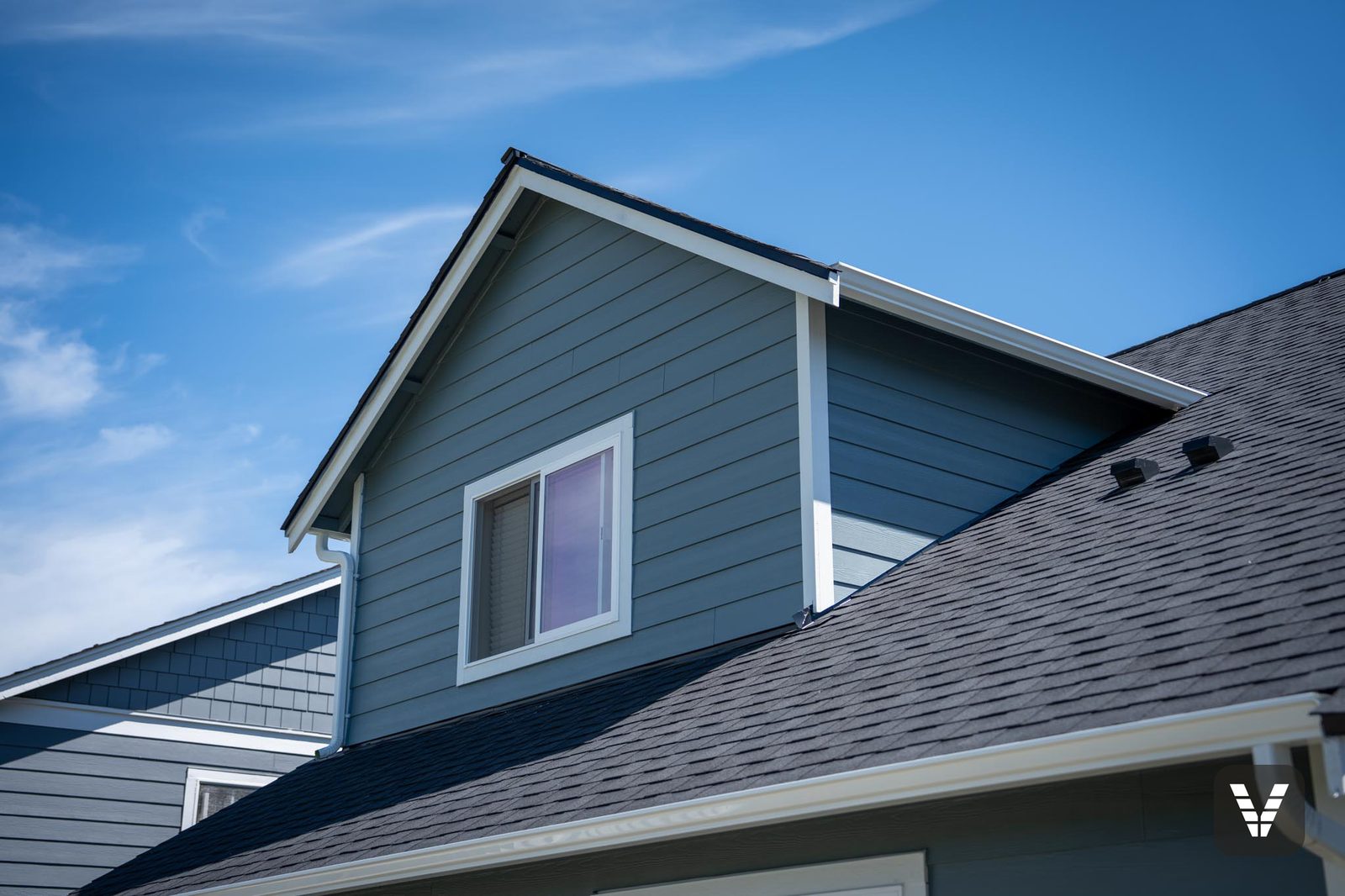 The dormer — new Milgard Trinsic V300 slider set clean in Arctic White trim — Siding & Window Vault project in Ferndale, WA