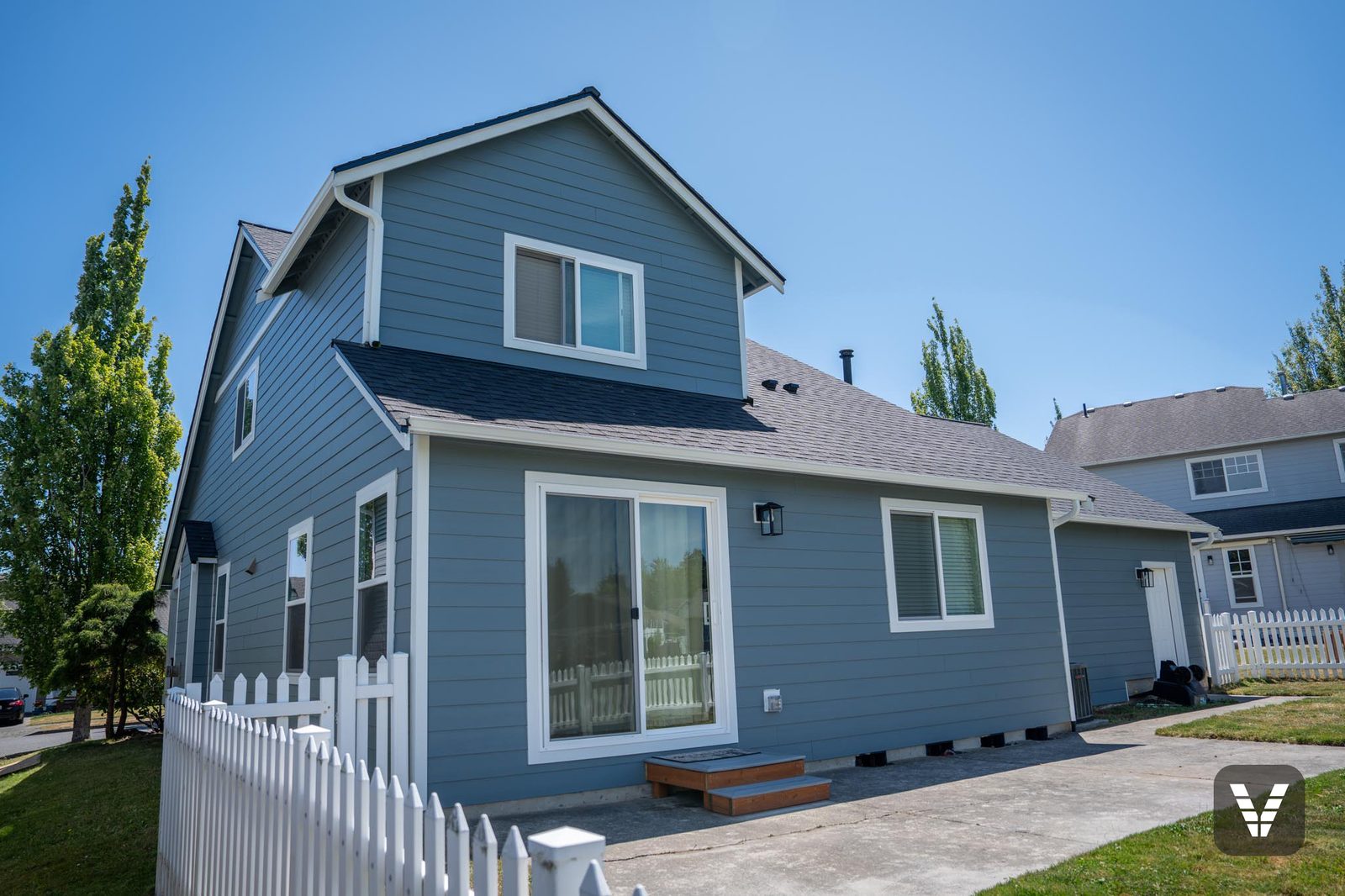 The rear of the home — every window new, every opening re-flashed — Siding & Window Vault project in Ferndale, WA