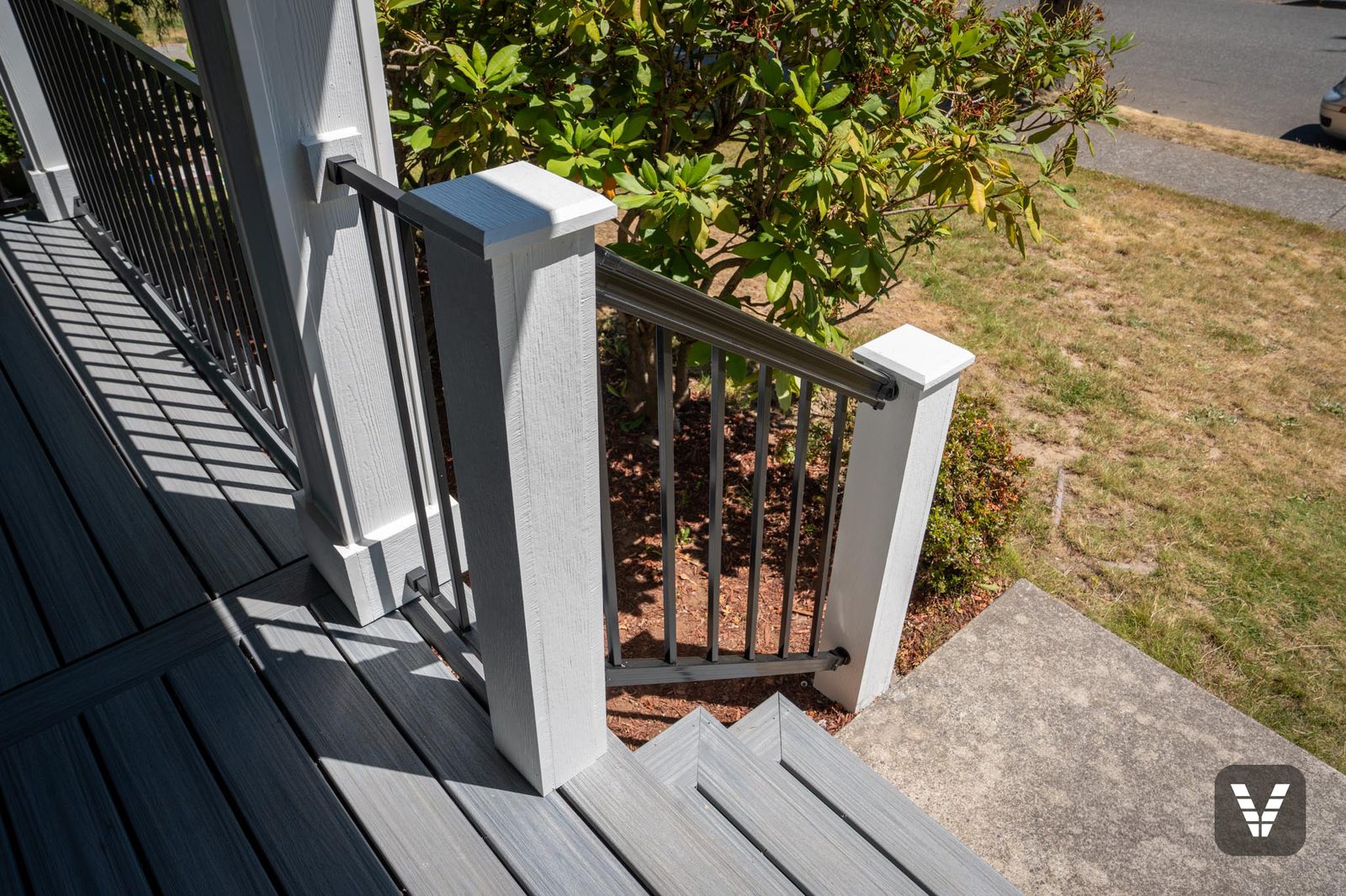 Looking down the new porch stair rail toward the front walk