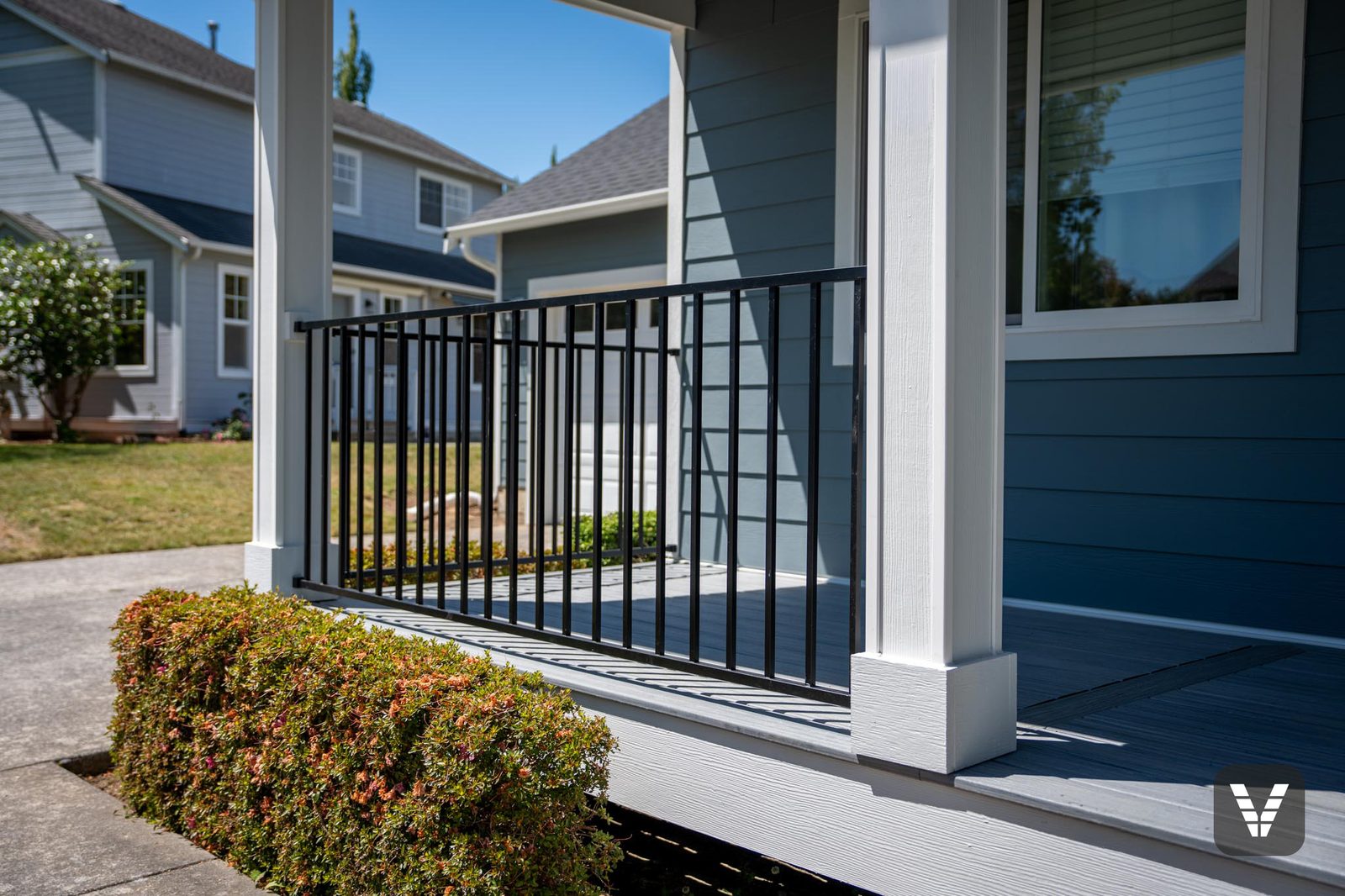The porch — deck columns re-wrapped in pre-finished HardieTrim and Hardie Panel