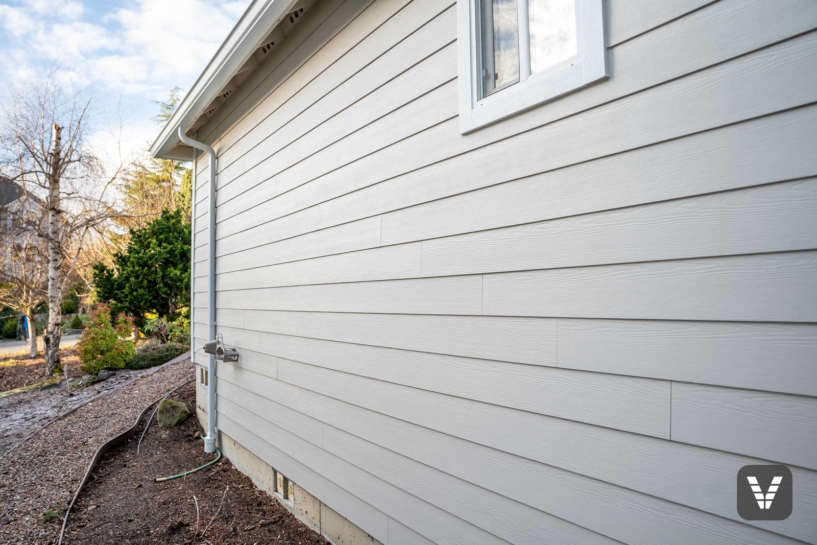 Cedarmill texture up close — seven-inch reveal Cobble Stone lap down the long side wall — Siding & Window Vault project in Bellingham, WA